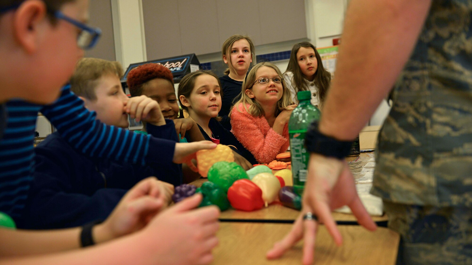 Children make healthy food choices during a Children’s Dental Health Month game, Feb. 15, 2017, at Aviano Air Base, Italy. The children practiced their brushing and flossing techniques and tested their knowledge on what food is better for healthy teeth. (U.S. Air Force photo by Senior Airman Cary Smith)