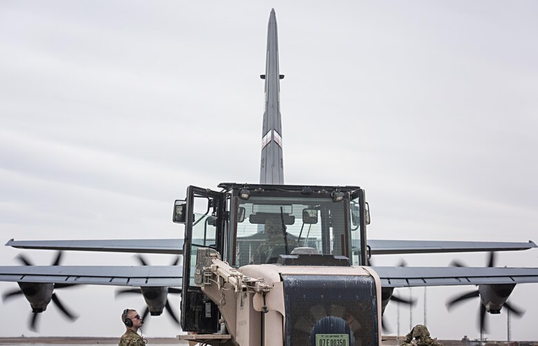 Senior Airman Brandon King, 774th Expeditionary Airlift Squadron loadmaster, directs cargo-loading onto a C-130J Hercules at Herat, Afghanistan, Feb. 17, 2017. The 774th EAS and their contingent of C-130 aircraft is based out of Dyess Air Force Base, Texas, along with the 455th EAMXS’s C-130 aircraft maintenance unit. (U.S. Air Force photo by Staff Sgt. Katherine Spessa)