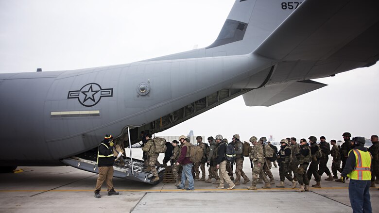 Passengers load onto a C-130J Hercules at Bagram Airfield, Afghanistan, Feb. 17, 2017. The 774th EAS uses the unique versatility of the C-130 to provide tactical airlift capabilities in and out of austere locations under atypical conditions. (U.S. Air Force photo by Staff Sgt. Katherine Spessa)