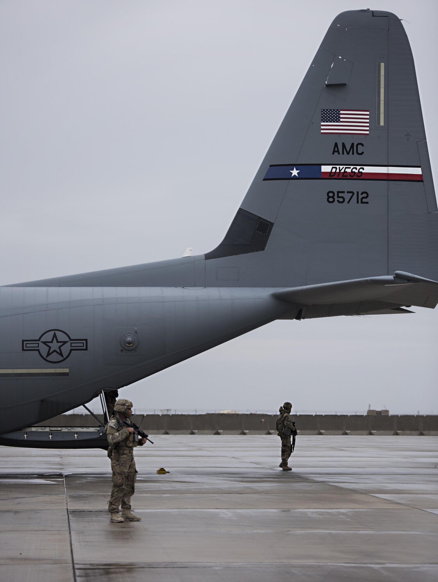 Airman 1st Class Trenton Clark and Staff Sgt. Rashon Battle, 455th Expeditionary Security Forces Squadron Fly Away Security Team members, provide security for a C-130J Hercules and its aircrew at Camp Bastion, Afghanistan, Feb. 17, 2017. C-130Js carrying personnel and cargo often require FAST members when travelling to remote locations. (U.S. Air Force photo by Staff Sgt. Katherine Spessa)