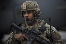 Airman 1st Class Trenton Clark, 455th Expeditionary Security Forces Squadron Fly Away Security Team member, watches over a C-130J Hercules and its aircrew at Camp Bastion, Afghanistan, Feb. 17, 2017. FAST members go through additional combatives and aircrew training and are prepared to provide security for aircraft, aircrew and cargo at austere locations, in case of a downed aircraft or in a hijack attempt. (U.S. Air Force photo by Staff Sgt. Katherine Spessa)