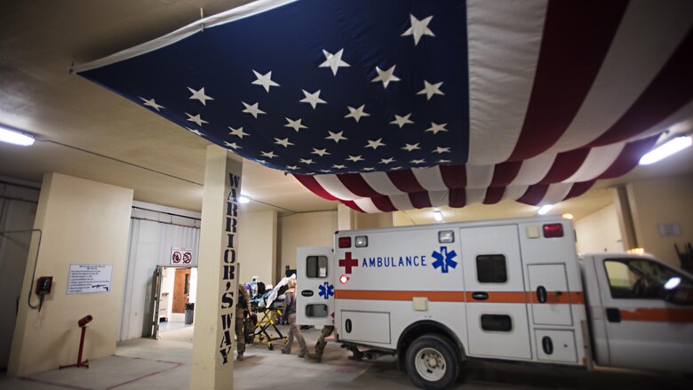 Members of the 455th Expeditionary Aeromedical Evacuation Squadron carry a patient from an ambulance into the Craig Joint Theater Hospital at Bagram Airfield, Afghanistan, Feb. 22, 2017. The 455th EAES provides care to U.S. and coalition service members, civilian employees and contractors throughout Afghanistan. (U.S. Air Force photo by Staff Sgt. Katherine Spessa)