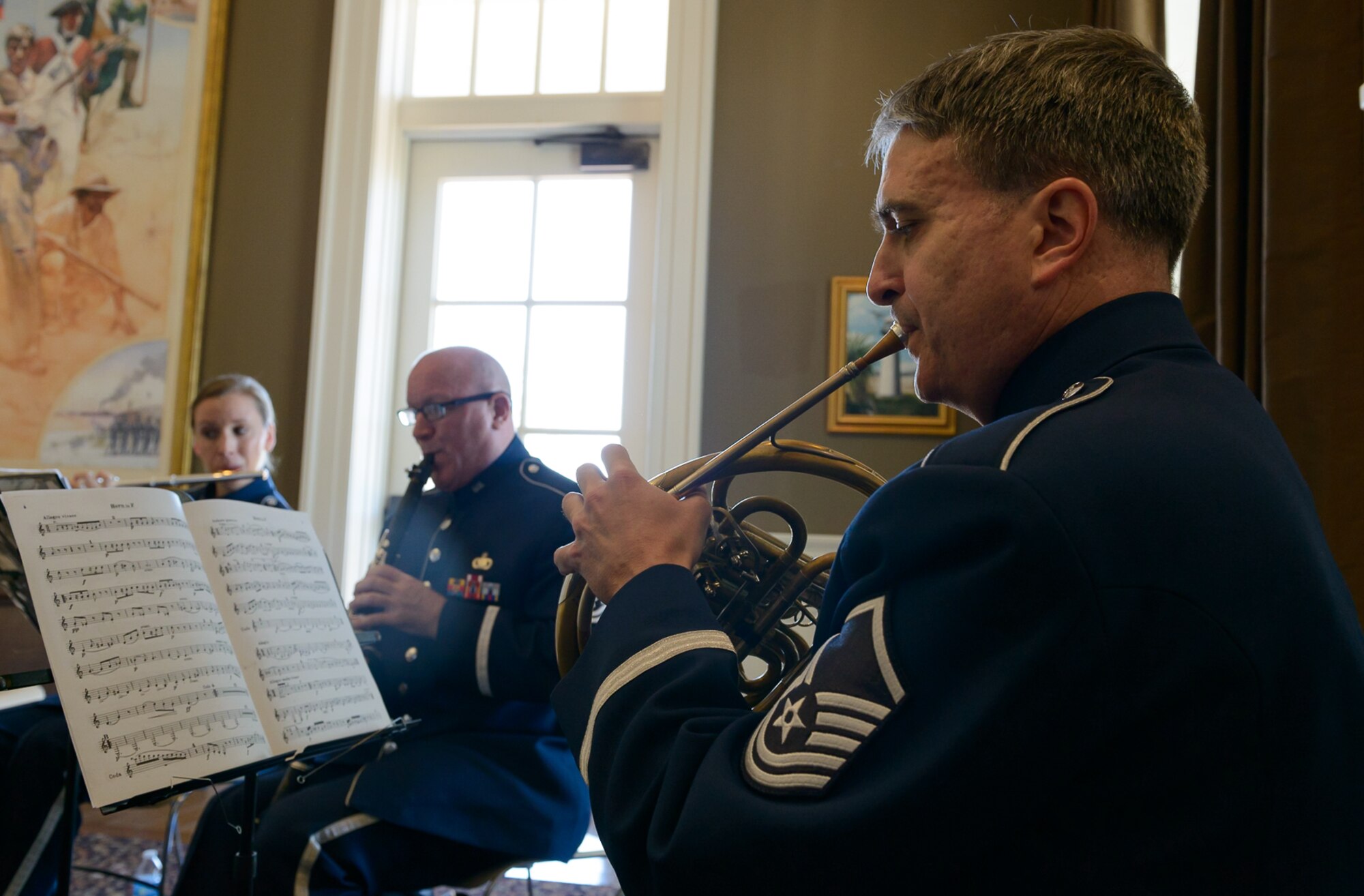 Master Sgt. Hughey Hancock, Band of the West hornist, plays a French horn at the Biloxi Visitor's Center Feb. 26, 2017 Biloxi, Miss. Members of the Spectrum Winds Quintet, an ensemble of the Band of the West,  played a medley of concert and ceremonial marching music for Gulf Coast residents and travelers. (U.S. Air Force photo by Andre' Askew)