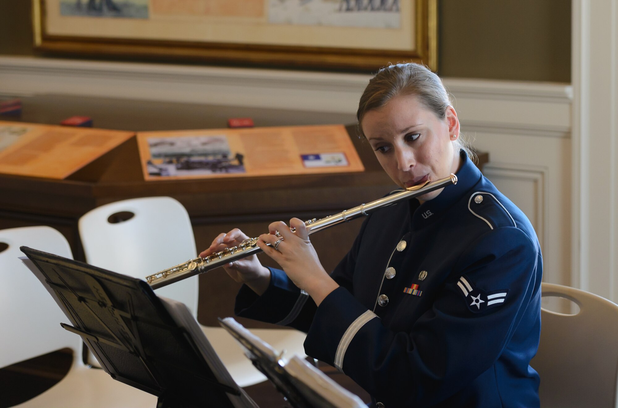 Airman 1st Class Elizabeth Robinson, Band of the West flautist, plays the flute for Gulf Coast residents and travelers at the Biloxi Visitor's Center Feb. 26, 2017 Biloxi, Miss. Members of the Spectrum Winds Quintet, an ensemble of the Band of the West, played a medley of concert and ceremonial marching music for the attendees. (U.S. Air Force photo by Andre' Askew)
