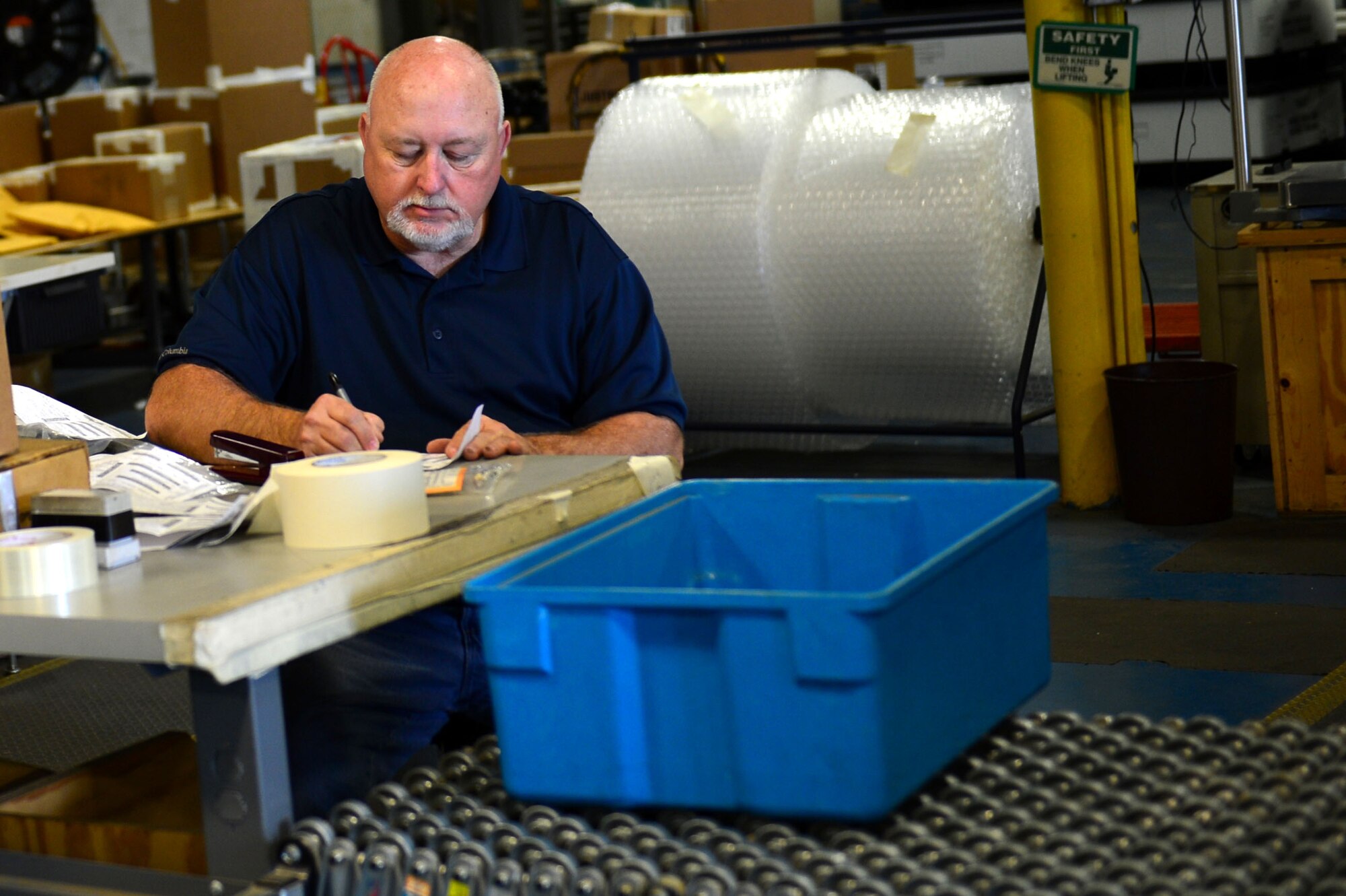 Alan Sherrill, 20th Logistics Readiness Squadron inbound cargo packer, inspects cargo at the 20th LRS cargo facility at Shaw Air Force Base, S.C., March 1, 2017. Team Shaw members assigned to the cargo facility ensure all base-wide cargo is quickly sent to its respective locations. (U.S. Air Force photo by Airman 1st Class Christopher Maldonado)