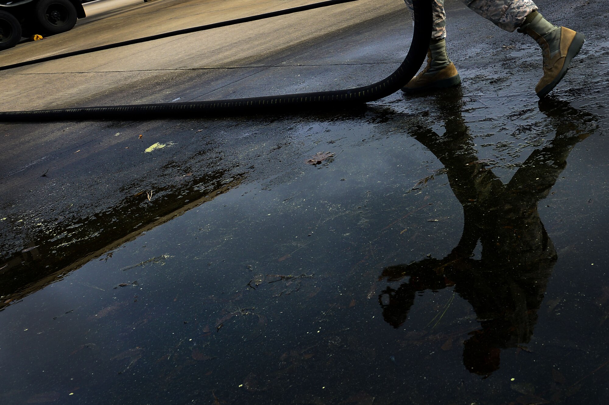 U.S. Air Force Senior Airman Dustin Hick, 20th Logistics Readiness Squadron petroleum, oil and lubricants preventative maintenance technician, rolls out a hose at Shaw Air Force Base, S.C., March 1, 2017. Airmen assigned to the POL flight provide fuel for jets on base. (U.S. Air Force photo by Airman 1st Class Christopher Maldonado)