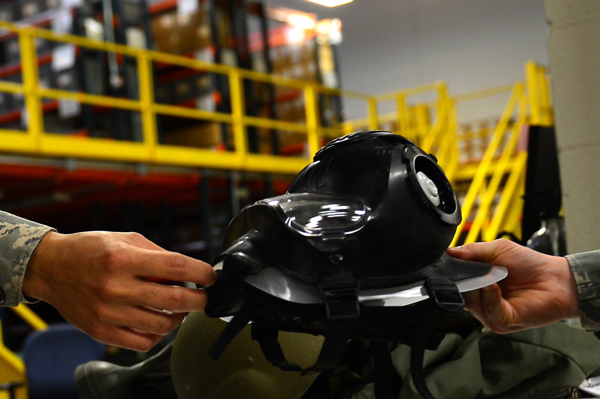 A U.S. Air Force Airman assigned to the 20th Logistics Readiness Squadron individual protective equipment flight performs an equipment exchange at the Chandler Deployment Processing Center at Shaw Air Force Base, S.C., March 2, 2017. The IPE flight is responsible for ensuring Airmen receive the proper gear needed to accomplish their mission in a deployed environment.(U.S. Air Force photo by Airman 1st Class Christopher Maldonado)
