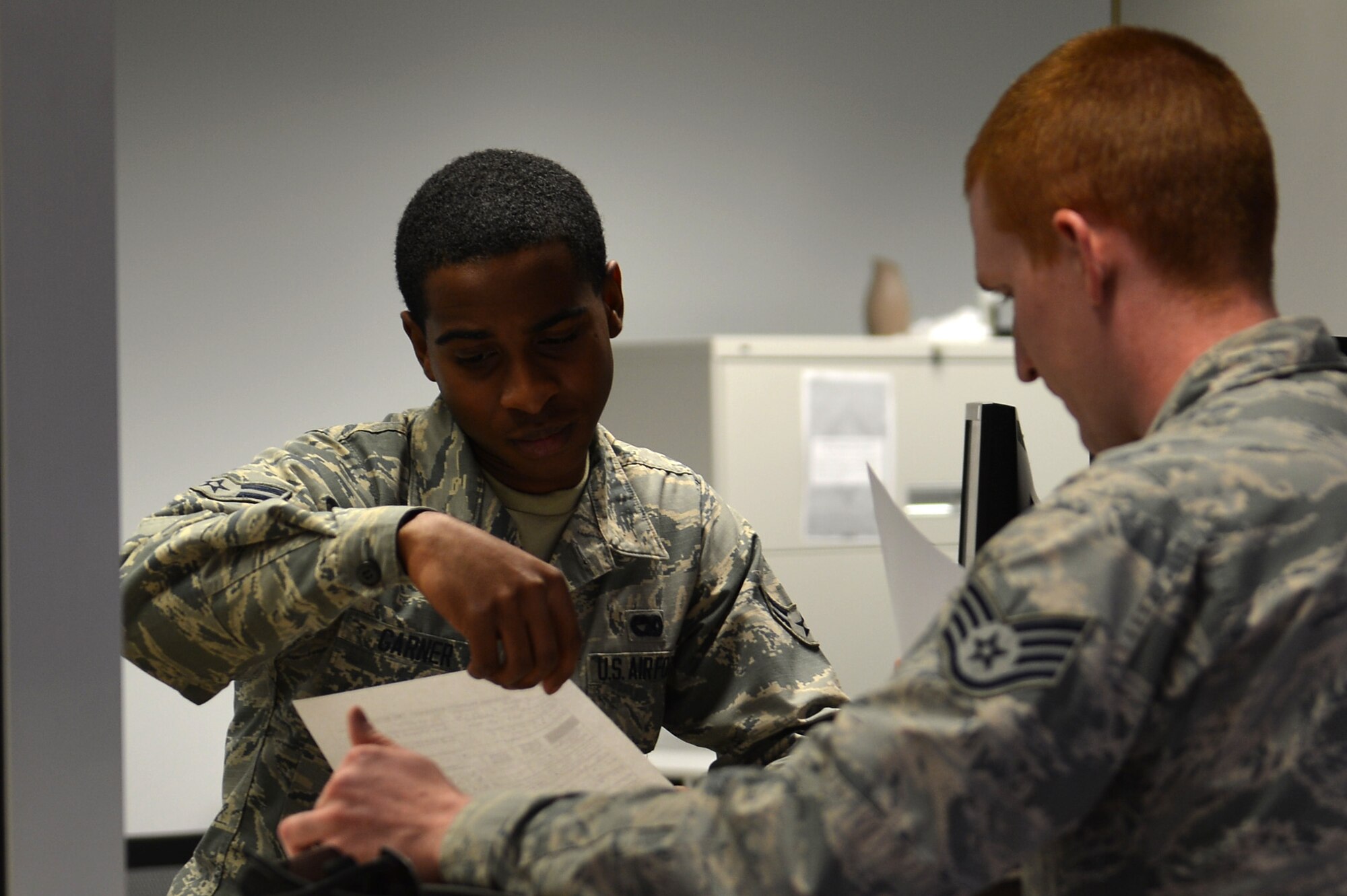 U.S. Air Force Airman 1st Class Danny Garner, 20th Logistics Readiness Squadron transportation management office technician, assists a Team Shaw member at Shaw Air Force Base, S.C., March 2, 2017. TMO provides services to Airmen who may need assistance physically moving their belongings during permanent changes of station. (U.S. Air Force photo by Airman 1st Class Christopher Maldonado)