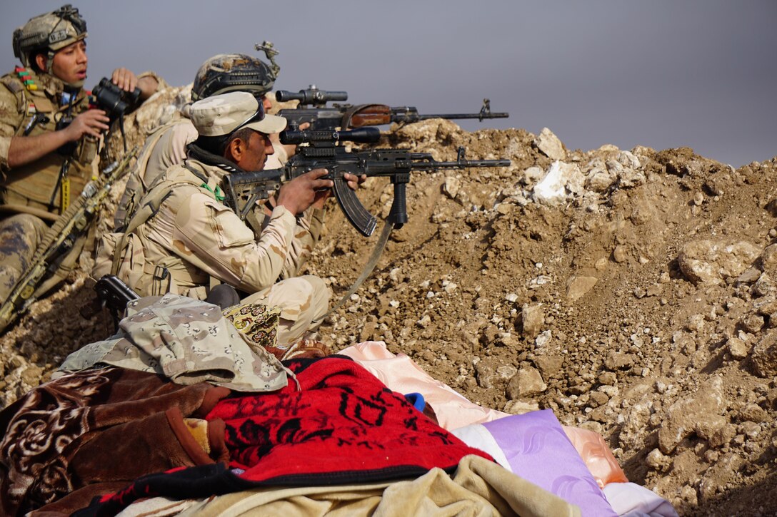 Iraqi army soldiers from 9th Iraqi Army Division scan the horizon at Al Asthana Ridge, Feb. 27, 2017. The 9th IAD is partnered with U.S. Army 2nd Battalion, 508th Parachute Infantry Regiment, 2nd Brigade Combat Team, 82nd Airborne Division. The 2nd BCT, 82nd Abn. Div. is deployed in support of Operation Inherent Resolve, to enable their Iraqi security forces partners through the advise and assist mission, contributing planning, intelligence collection and analysis, force protection, and precision fires to achieve the military defeat of ISIS.  CJTF-OIR is the global Coalition to defeat ISIS in Iraq and Syria. (U.S. Marine Corps photo by Capt. Timothy Irish)