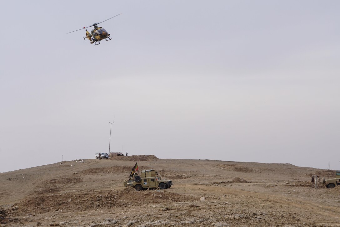 An Iraqi Army Aviation Bell 407 helicopter overflies a 9th Iraqi Army Division humvee after providing close air support for the 9th IAD’s brigades at Al Asthana Ridge, Feb. 27, 2017.  The 9th IAD is partnered with U.S. Army 2nd Battalion, 508th Parachute Infantry Regiment, 2nd Brigade Combat Team, 82nd Airborne Division.  The 2nd BCT, 82nd Abn. Div. is deployed in support of Operation Inherent Resolve, to enable their Iraqi security forces partners through the advise and assist mission, contributing planning, intelligence collection and analysis, force protection, and precision fires to achieve the military defeat of ISIS.  CJTF-OIR is the global Coalition to defeat ISIS in Iraq and Syria. (U.S. Marine Corps photo by Capt. Timothy Irish)