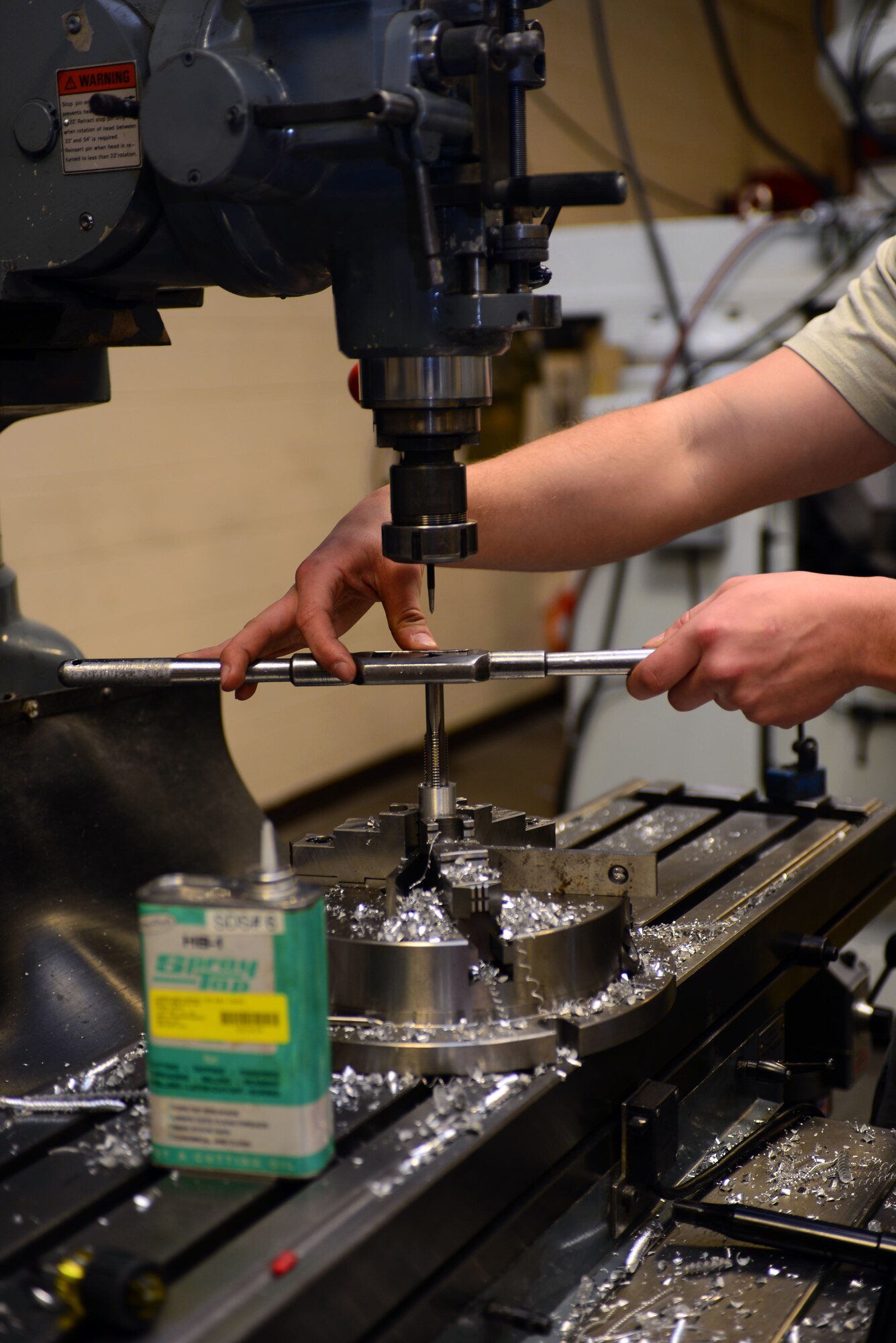 Airman 1st Class Herbert Schools, an aircraft metals technology apprentice assigned to the 28th Maintenance Squadron, threads equipment using the new VF5 Super Speed, and the UMC 750 Super Speed at Ellsworth Air Force Base, S.D., Feb. 22, 2017. Threading, the process of creating screw heads, has many different methods of being manufactured to include thread cutting and rolling allowing multiple options to create parts needed. (U.S. Air Force photo by Airman 1st Class Donald C. Knechtel)