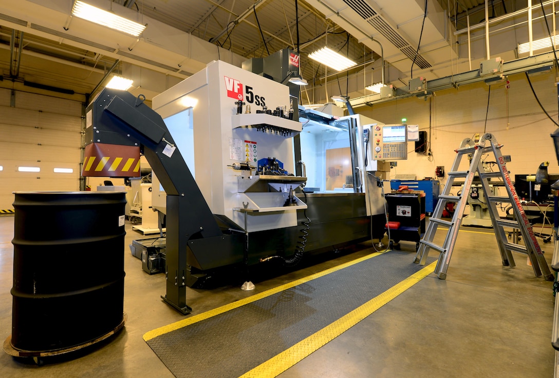 The 28th Maintenance Squadron fabrication shop received new Computer Numeric Controlled Milling equipment at Ellsworth Air Force Base, S.D., Feb. 22, 2017. The two new machines consist of a three axis drilling machine and a fifth axis machine that help the shop make products faster and more exact. (U.S. Air Force photo by Airman 1st Class Donald C. Knechtel)