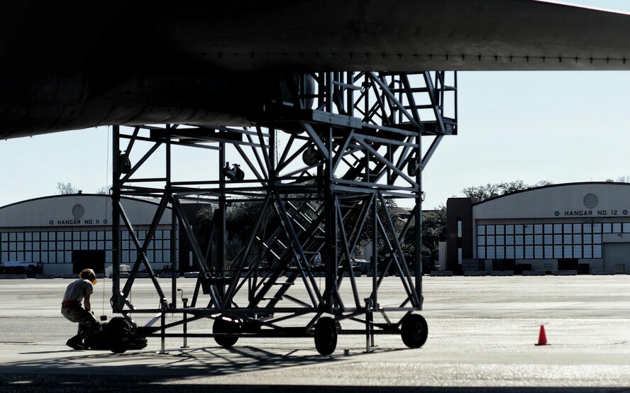 A crew chief from the 20th Aircraft Maintenance Unit prepares to hoist up a drag chute for installation on a B-52 Stratofortress during a Quick Regeneration Exercise at Barksdale Air Force Base, La., Feb. 23, 2017. During landing, the aircraft deploys a drag parachute to assist with deceleration, reducing wear and tear of ceramic brake pads. After parachute deployment, a new one must be installed prior to take-off. (U.S. Air Force photo/Senior Airman Mozer O. Da Cunha)