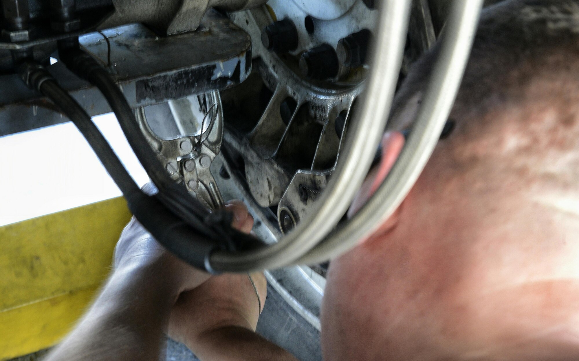 Staff Sgt. Richardt Figueroa, 20th Aircraft Maintenance Unit crew chief, secures a tow bar to the landing gear on a B-52 Stratofortress during a Quick Regeneration Exercise at Barksdale Air Force Base, La., Feb. 23, 2017. In addition to towing the aircraft, Airmen also re-installed a drag parachute, performed on-site systems inspections, re-fueling and engine maintenance. (U.S. Air Force photo/Senior Airman Mozer O. Da Cunha)