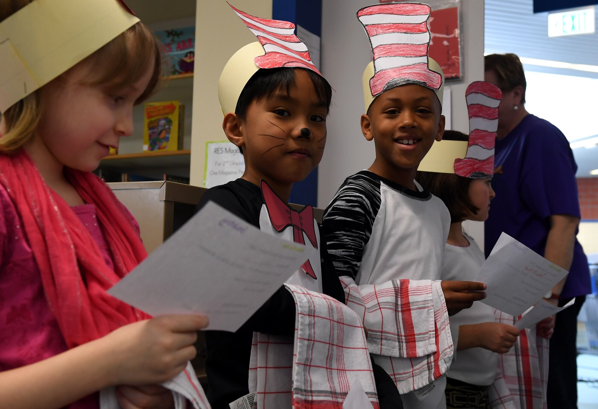Ramstein Elementary School students pose as hosts to seat students during the Seuss Reading Café at Ramstein Air Base, Germany, March 3, 2017.  Faculty assisted students helping with the reading café as hosts, servers and clean-up crew. (U.S. Air Force photo by Staff Sgt. Nesha Humes)