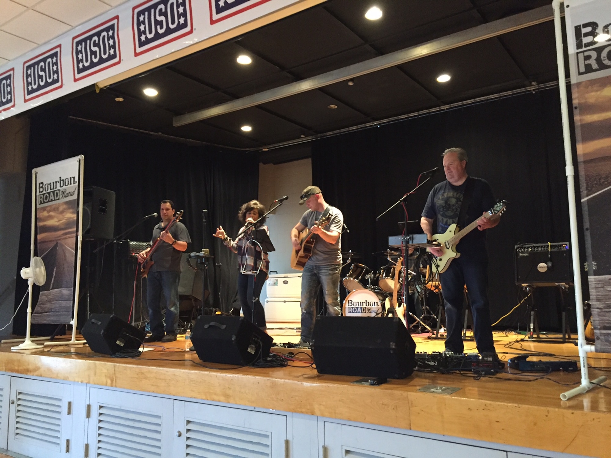 Members of the Cincinnati-based band Bourbon Road donate their time and talents to the first anniversary of the USO Community Center, Bldg. 1222, Kittyhawk Center, Area A, Wright-Patterson Air Force Base, Feb. 24. Wesley Green, singer and guitarist, works at HQ Air Force Materiel Command as the equipment, training and operations manager for weather operations. Green often volunteers at the center. (Skywrighter photo/Amy Rollins)