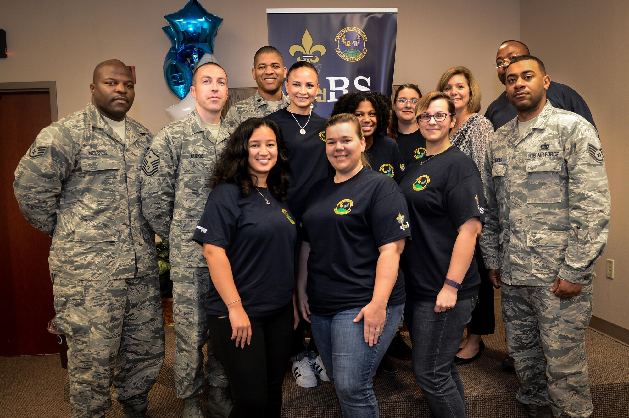 Key Spouses and Squadron leadership with the 2nd Logistics Readiness Squadron pose for a photo at Barksdale Air Force Base, La., Feb. 7, 2017. The Key Spouses and leadership met to discuss ways to link leadership, Airmen and families together to promote individual, family, and unit readiness. (U.S. Air Force photo/Senior Airman Mozer O. Da Cunha)