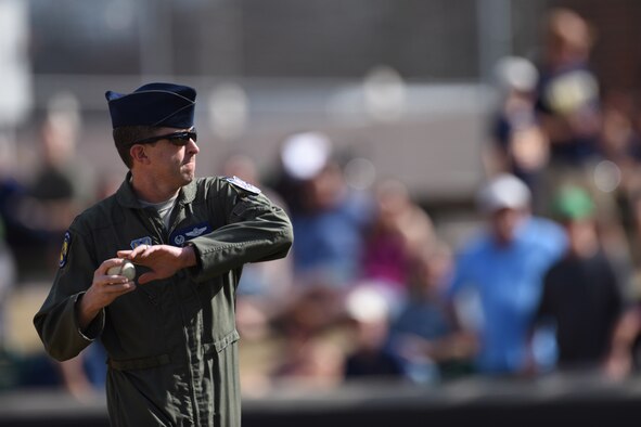 Col. Christopher Sage, the 4th Fighter Wing commander, throws out the first pitch during the Freedom Classic, Feb. 25, 2017 at Grainger Stadium in Kinston, N.C. Though the Navy had their bases loaded late in the game, the Falcons shot out their potential to score with inning-ending double plays; winning the series. (U.S. Air Force photo/Airman 1st Class Victoria Boyton)