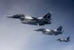 U.S. Air Force F-16 Fighting Falcons, assigned to the 18th Aggressor Squadron, fly in formation next to a 909th Air Refueling Squadron KC-135 Stratotanker March 1, 2017, off the coast of Guam. Twenty-two flying units from U.S. Pacific Command, Japan Air Self-Defense Force and the Royal Australian Air Force are in Andersen Air Force Base, Guam, to participate in annual exercise, Cope North. (U.S. Air Force photo/Senior Airman John Linzmeier)