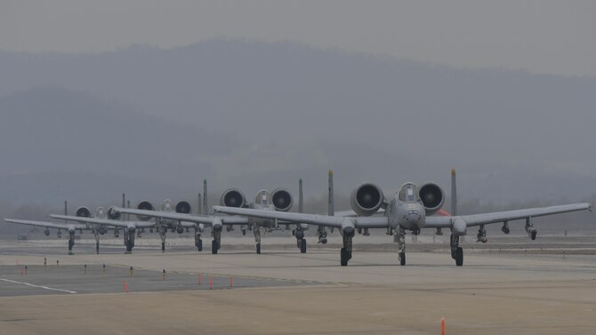Four A-10 Thunderbolt IIs assigned to the 25th Fighter Squadron taxi out for a training mission during exercise Beverly Herd 17-1 at Osan Air Base, Republic of Korea, March 1, 2017. Exercise Beverly Herd placed a temporary pause on normal day-to-day activities at Osan AFB, allowing the base to run through an all-hands-on-deck scenario dedicated to 100 percent mission accomplishment. (U.S. Air Force photo/Staff Sgt. Victor J. Caputo)