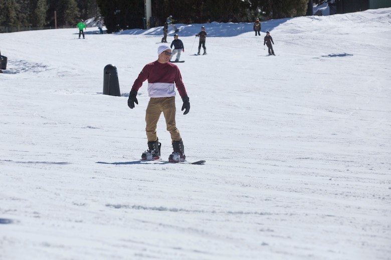 Lance Cpl. Omar Irizarry, rifleman, 2nd Battalion, 7th Marine Regiment, snowboards during a trip to Bear Mountain Ski Resort in Big Bear Lake, Feb. 23, 2017. The trip was provided to the unit courtesy of Operation Adrenaline Rush, a program aimed toward reintegrating Marines and sailors who have just come home from deployment. (U.S Marine photo by Cpl. Medina Ayala-Lo)
