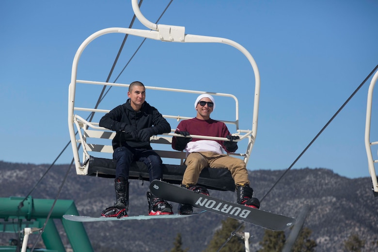 Pfc. Dante Garza and Lance Cpl. Omar Irizarry, riflemen, 2nd Battalion, 7th Marine Regiment, ride a ski lift during a trip to Bear Mountain Ski Resort in Big Bear Lake, Feb. 23, 2017. The trip was provided to the unit courtesy of Operation Adrenaline Rush, a program aimed toward reintegrating Marines and sailors who have just come home from deployment. (U.S Marine photo by Cpl. Medina Ayala-Lo)