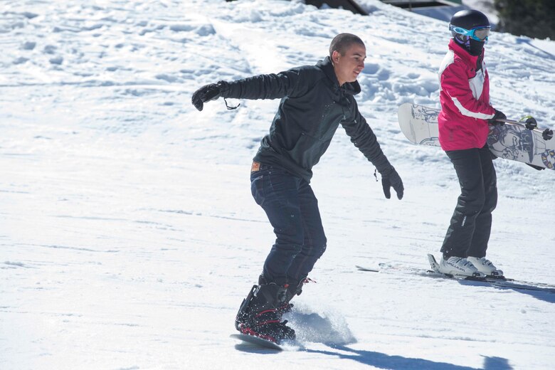 Pfc. Dante Garza, rifleman, 2nd Battalion, 7th Marine Regiment, snowboards during a trip to Bear Mountain Ski Resort in Big Bear Lake, Feb. 23, 2017. The trip was provided to the unit courtesy of Operation Adrenaline Rush, a program aimed toward reintegrating Marines and sailors who have just come home from deployment. (U.S Marine photo by Cpl. Medina Ayala-Lo)