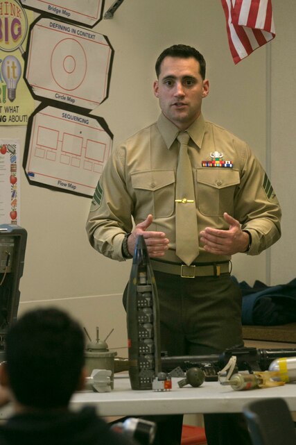 Sgt. Alexander Strait, explosive ordnance diposal technician, talks to Painted Hills Middle School students during a career day in Desert Hot Springs, Calif., Feb. 23, 2017. The purpose of the visit was to further the installations commitment to the community and help inspire children to begin thinking about their future. (Official Marine Corps Photo by Cpl. Julio McGraw/Released)