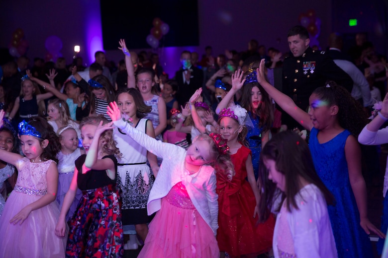 Marines’ and sailors’ daughters enjoy themselves on the dance floor of the reception hall during the annual Father Daughter Dance at building 1707 aboard Marine Corps Air Ground Combat Center, Twentynine Palms, Calif., Feb. 25, 2017. Marine Corps Community Services hosted the event to provide an opportunity for Marines and sailors to spend time with their daughters. (U.S. Marine Corps photo by Cpl. Medina Ayala-Lo)