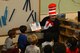 U.S. Air Force Chief Master Sgt. Steven Mullens, 20th Communications Squadron superintendent, reads “The Cat in the Hat” to children at the Child Development Center at Shaw Air Force Base, S.C., March 2, 2017. Mullens visited the CDC and the youth center for the birthday of Theodor Seuss Geisal, better known by his pen name, Dr. Seuss. (U.S. Air Force photo by Airman 1st Class Destinee Sweeney)