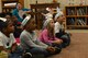 Team Shaw children listen to a reading of “The Cat in the Hat” at Shaw Air Force Base, S.C., March 2, 2017. U.S. Air Force Chief Master Sgt. Steven Mullens, 20th Communications Squadron superintendent, read the book to various classrooms at the Child Development Center and youth center in honor of Theodor Seuss Geisel, an American children’s book writer who went by the pen name, Dr. Seuss. Throughout his career Geisel wrote and illustrated more than 40 children’s books. (U.S. Air Force photo by Airman 1st Class Destinee Sweeney)