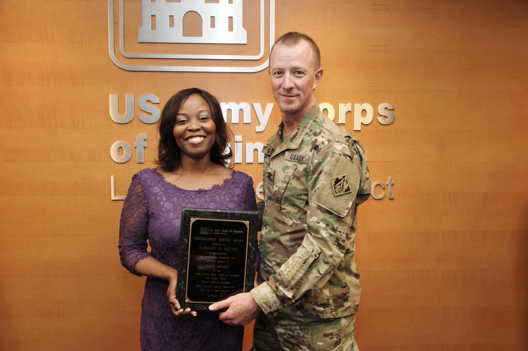 Col. Kirk Gibbs, District commander of the U.S. Army Corps of Engineers Los Angeles District presents Hon. Margery Melvin, keynote speaker, a Distinguished Service Award in recognition of her Black History Month presentation. 

The U.S. Army Corps of Engineers Los Angeles District Black Employment Special Emphasis Program committee held its Black History Month observance closing ceremony at the District's headquarters Feb. 23.