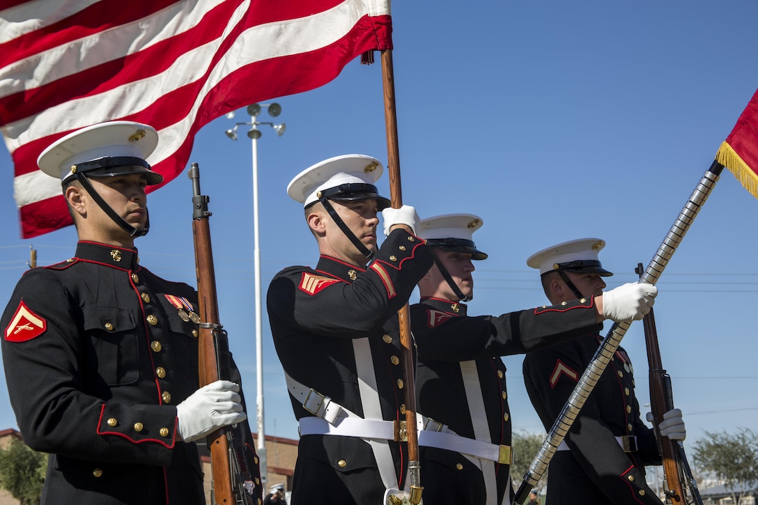 The Marine Corps Color Guard Marines present the national flag and the Marine Corps battle colors at a dress rehearsal during a portion of their month-long training phase as a part of the U.S. Marine Corps Battle Color Detachment (BCD) aboard Marine Corps Air Station Yuma, Az., Feb. 24, 2017. The BCD is comprised of the Marine Corps Silent Drill Platoon, “The Commandant’s Own,” the United States Marine Drum & Bugle Corps and the Marine Corps Color Guard. The unit’s overall mission while training aboard MCAS Yuma, is to hone and perfect their precision drill movements and musical ballads for not only the coming West and East Coast tours, but as well as the ceremonial duties they are tasked with year-round as units of Marine Barracks Washington. (Official Marine Corps photo by Cpl. Robert Knapp/Released)