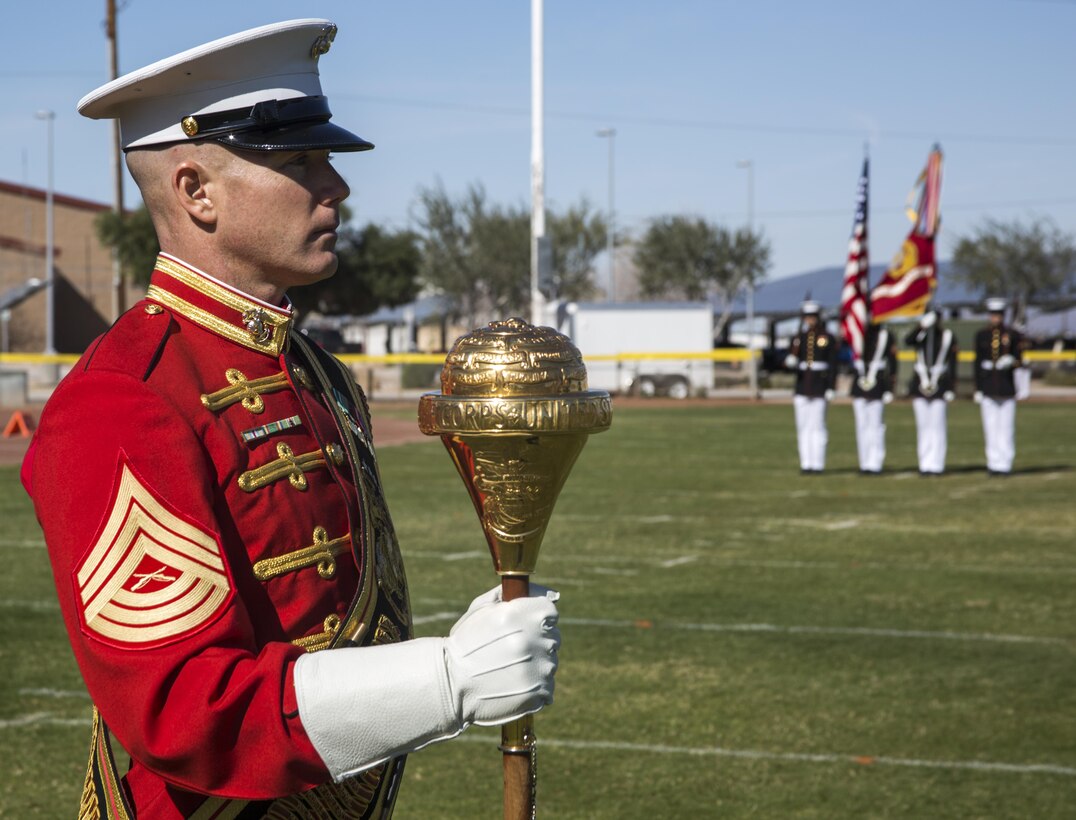 Master Sgt. Keith Martinez, assistant drum major, “The Commandant’s Own,” the U.S. Marine Drum & Bugle Corps (D&B), takes charge of the D&B Marines at a dress rehearsal during a portion of their month-long training phase as a part of the U.S. Marine Corps Battle Color Detachment (BCD) aboard Marine Corps Air Station Yuma, Az., Feb. 24, 2017. The BCD is comprised of the Marine Corps Silent Drill Platoon, “The Commandant’s Own,” the United States Marine Drum & Bugle Corps and the Marine Corps Color Guard. The unit’s overall mission while training aboard MCAS Yuma, is to hone and perfect their precision drill movements and musical ballads for not only the coming West and East Coast tours, but as well as the ceremonial duties they are tasked with year-round as units of Marine Barracks Washington. (Official Marine Corps photo by Cpl. Robert Knapp/Released)