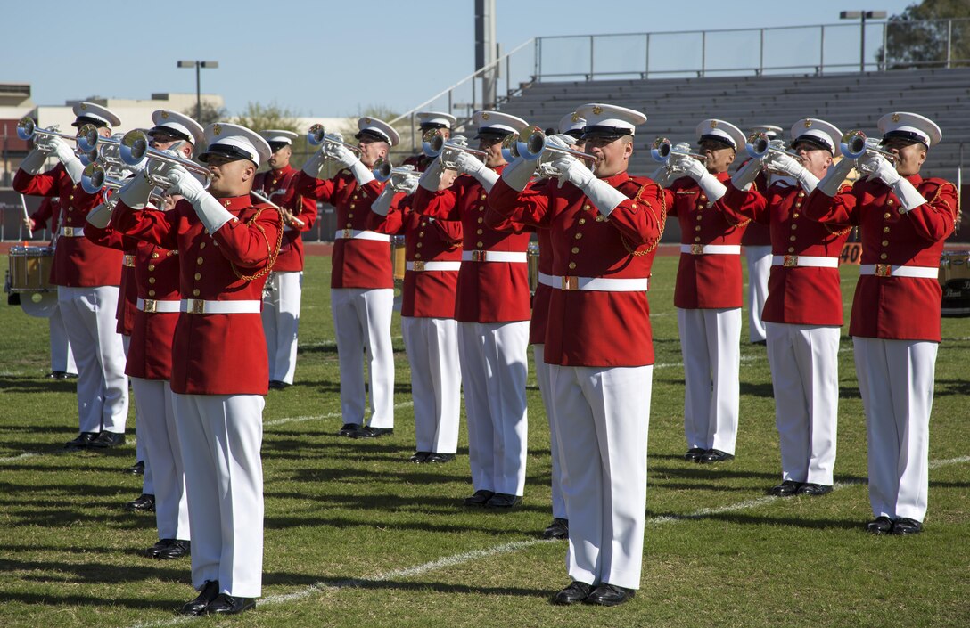 Marines with the U.S. Marine Drum & Bugle Corps execute music in motion during their first performance as a part of the U.S. Marine Corps Battle Color Detachment (BCD) performance tour at Kofa High School, Yuma, Az., Mar. 1, 2017. The BCD is comprised of the Marine Corps Silent Drill Platoon, “The Commandant’s Own,” the United States Marine Drum & Bugle Corps and the Marine Corps Color Guard. The Marines of this highly skilled unit travel across the country to demonstrate the discipline, professionalism, and “Esprit de Corps” of United States Marines. (Official Marine Corps photo by Cpl. Robert Knapp/Released)