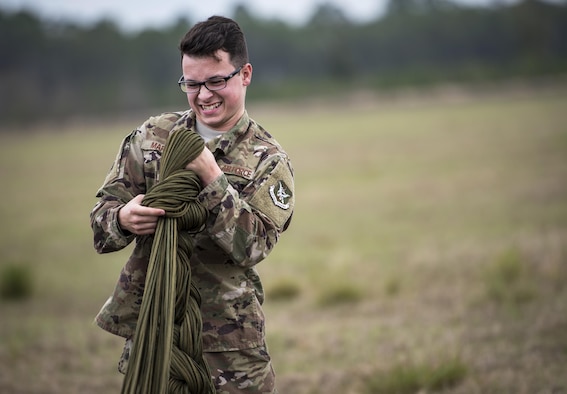 Airman Matthew Marston, 38th Rescue Squadron aircrew flight equipment apprentice, prepares a parachute for packing after a military RZR all-terrain vehicle was dropped from a HC-130J Combat King II, after a vehicle drop exercise, March 1, 2017, at Moody Air Force Base, Ga. This was the first time the 38th Rescue Squadron dropped a MRZR and a significant feat as it landed on target, with no damage or discrepancies. (U.S. Air Force photo by Airman 1st Class Janiqua P. Robinson)
