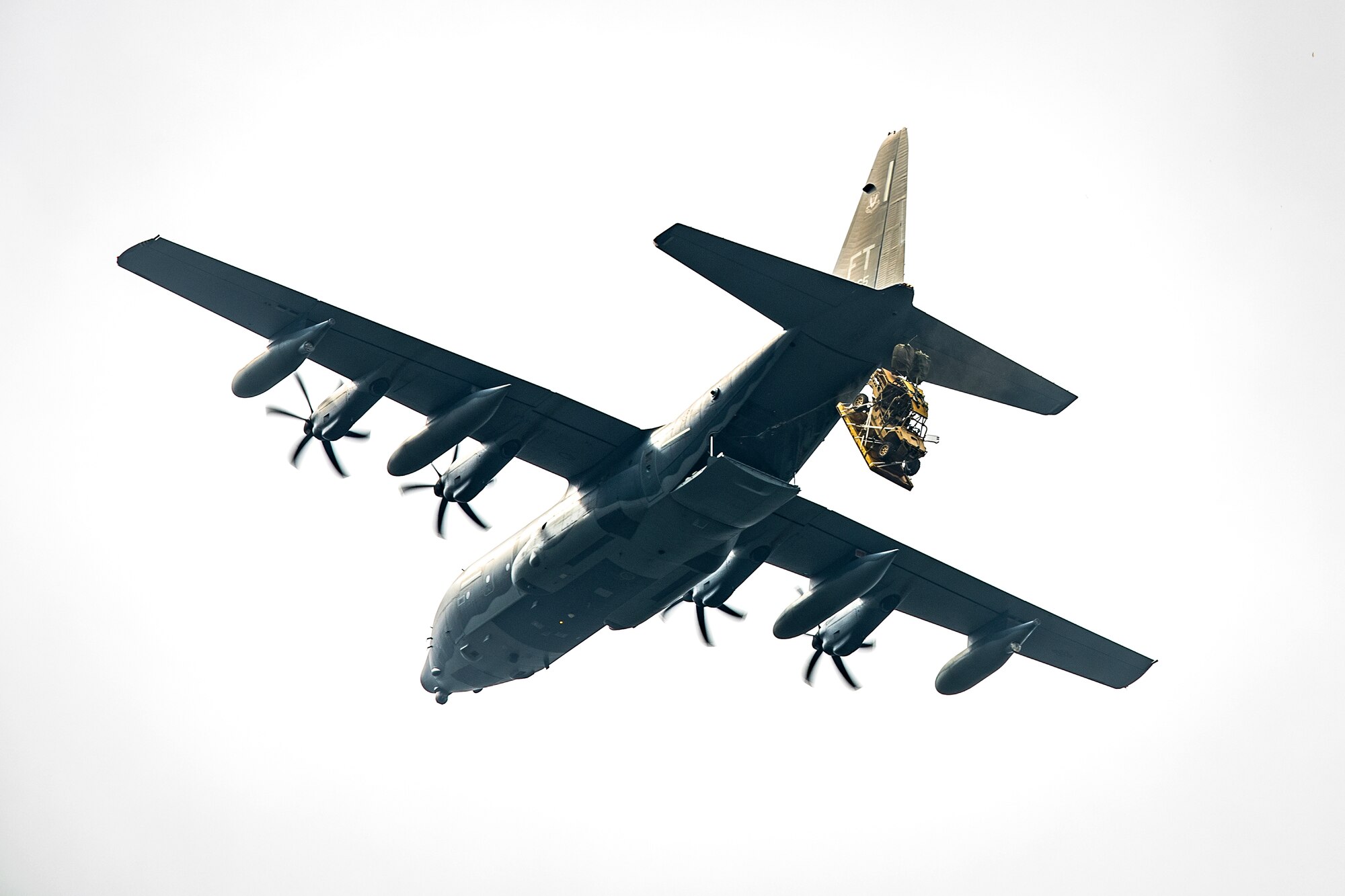 A military RZR all-terrain vehicle plummets from the exit hatch of a HC-130J Combat King II, during a vehicle drop exercise, March 1, 2017, at Moody Air Force Base, Ga. This was the first time the 38th Rescue Squadron dropped a MRZR and a significant feat as it landed on target, with no damage or discrepancies. (U.S. Air Force photo by Airman 1st Class Janiqua P. Robinson)