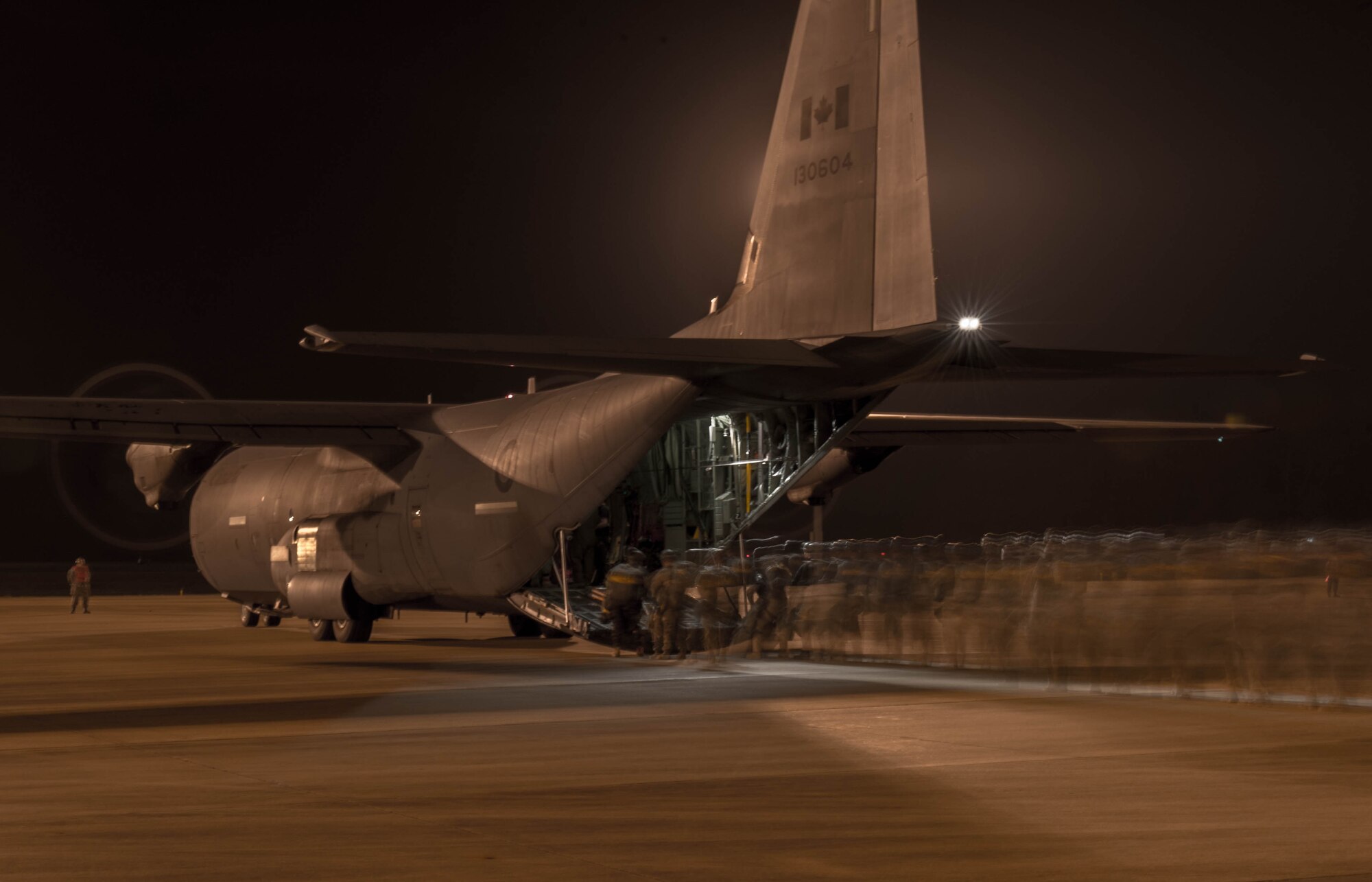 Soldiers prepare to board a Royal Canadian Air Force C-130J Super Hercules during a Joint Readiness Training exercise, Feb. 11, 2016, at Alexandria International Airport, LA. Throughout the exercise the aerial port team loaded and offloaded 101 C-130 Super Hercules and 21 C-17 Globemaster III aircraft and moved 282 short tons of cargo during the exercises, as well as supporting the movement of more than 670 passengers. (U.S. Air Force photo by Staff Sgt. Robert Hicks)