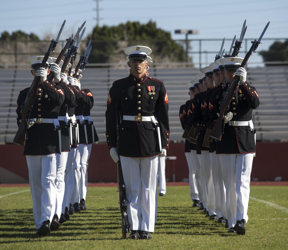 Marines with the Marine Corps Silent Drill Platoon execute the movement known as “meat grinders” during their first performance as a part of the U.S. Marine Corps Battle Color Detachment (BCD) performance tour at Kofa High School, Yuma, Az., Mar. 1, 2017. The BCD is comprised of the Marine Corps Silent Drill Platoon, “The Commandant’s Own,” the United States Marine Drum & Bugle Corps and the Marine Corps Color Guard. The Marines of this highly skilled unit travel across the country to demonstrate the discipline, professionalism, and “Esprit de Corps” of United States Marines. (Official Marine Corps photo by Cpl. Robert Knapp/Released)