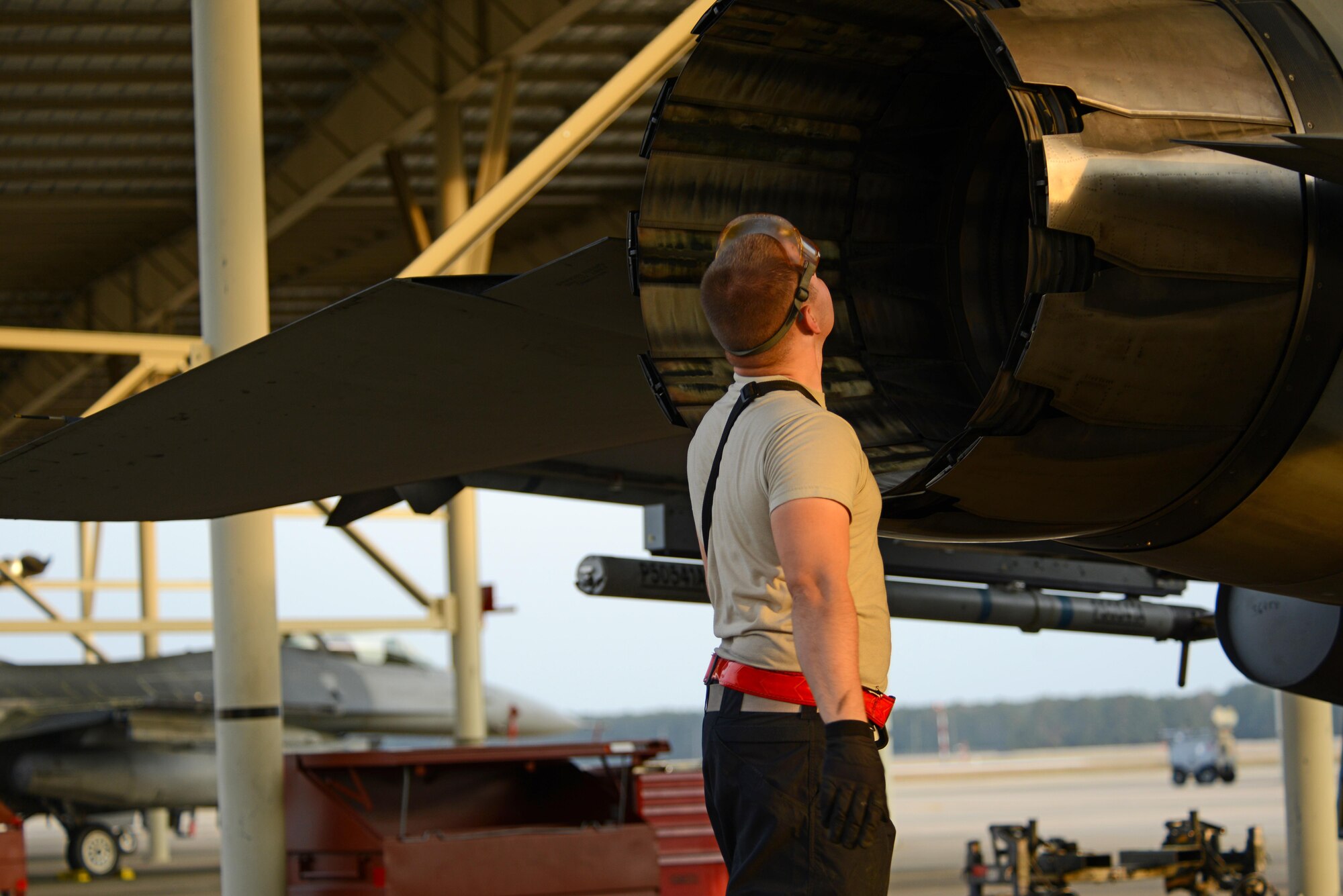 U.S. Air Force Airman 1st Class Zachary Rogers, 20th Aircraft Maintenance Squadron tactical aircraft maintainer, visually inspects a F-16CM Fighting Falcon while refueling at Shaw Air Force Base, S.C., Feb. 28, 2017. The inspection is performed to ensure the aircraft is not leaking fuel. (U.S. Air Force photo by Airman 1st Class Kathryn R.C. Reaves)