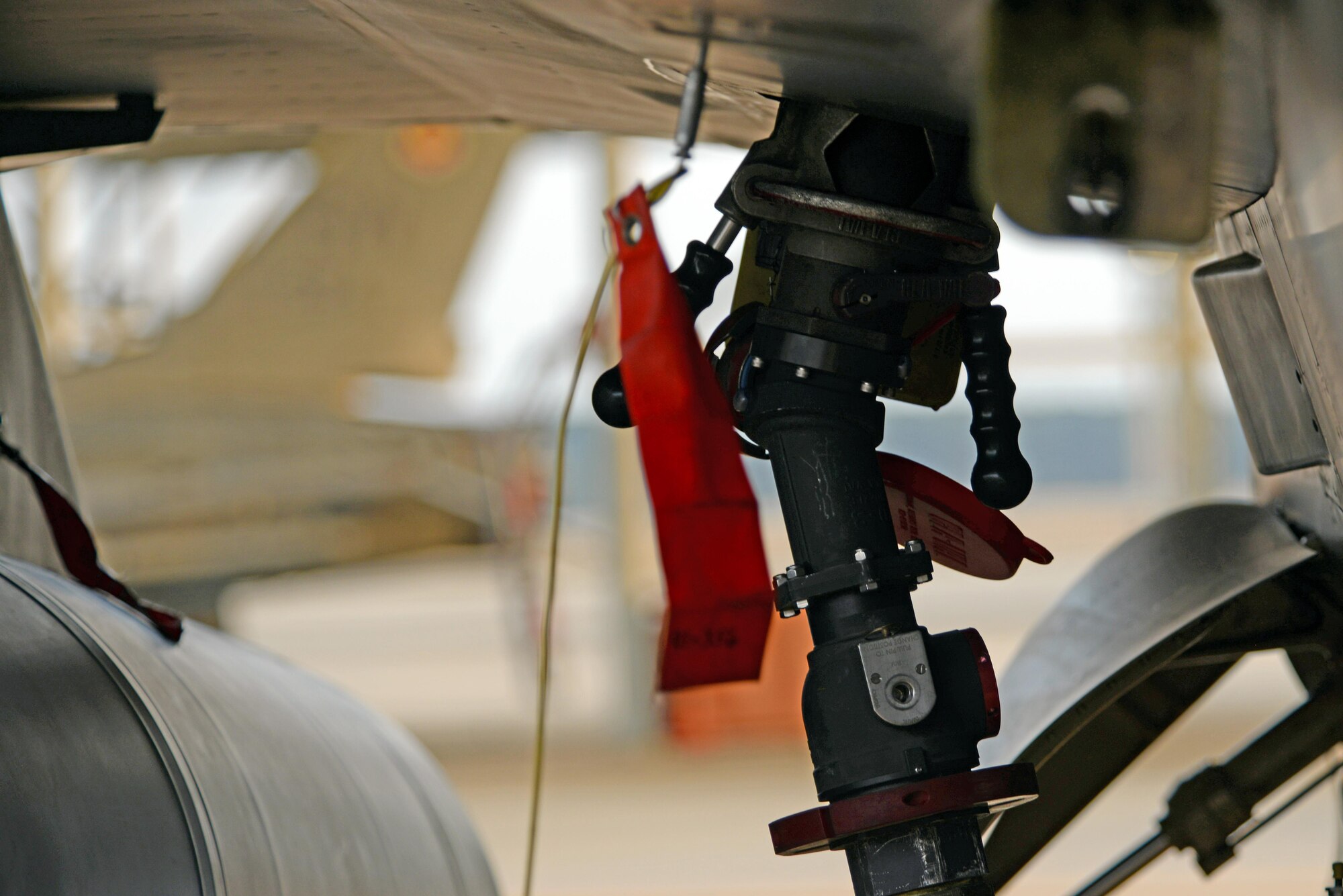 A fuel nozzle is connected to a F-16CM Fighting Falcon on the flightline at Shaw Air Force Base, S.C., Feb. 28, 2017. The nozzle’s hose is connected to a R-11 refueling truck which provides Jet A fuel to the aircraft at an average rate of 400 gallons per minute. (U.S. Air Force photo by Airman 1st Class Kathryn R.C. Reaves)