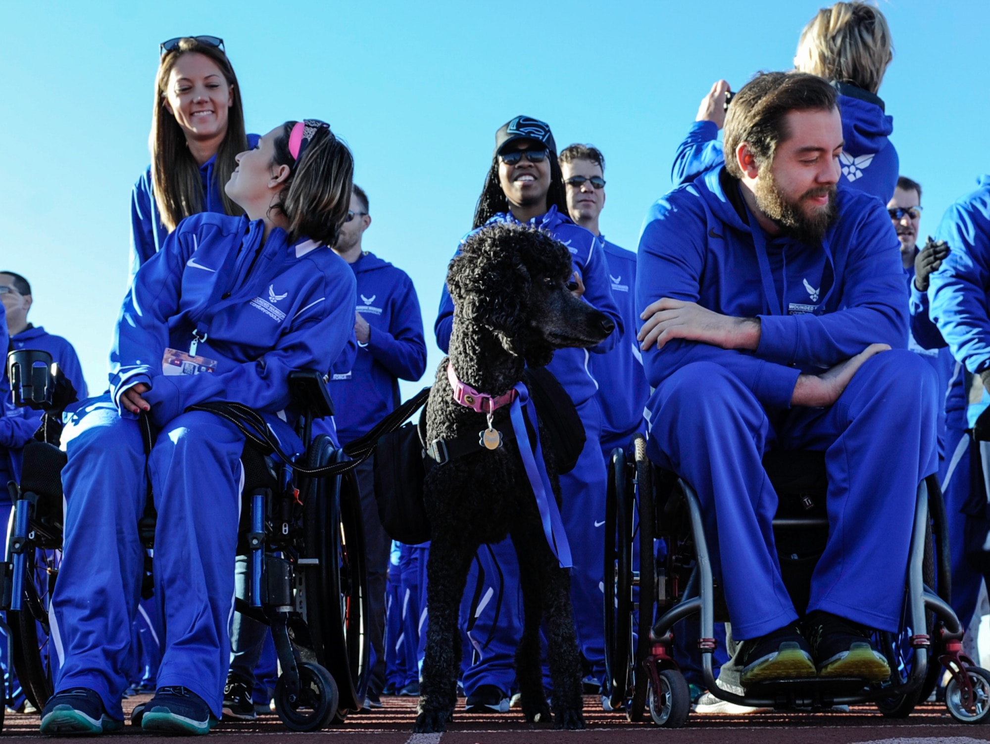 Competitors wait to be announced before the 2017 Air Force Wounded Warrior Trials opening ceremony on Nellis Air Force Base, Nev., Feb. 24, 2017. The Trials are an adaptive sports event designed to promote the mental and physical well-being of seriously ill and injured military members and veterans. (U.S. Air Force photo by Airman 1st Class Kevin Tanenbaum/Released)