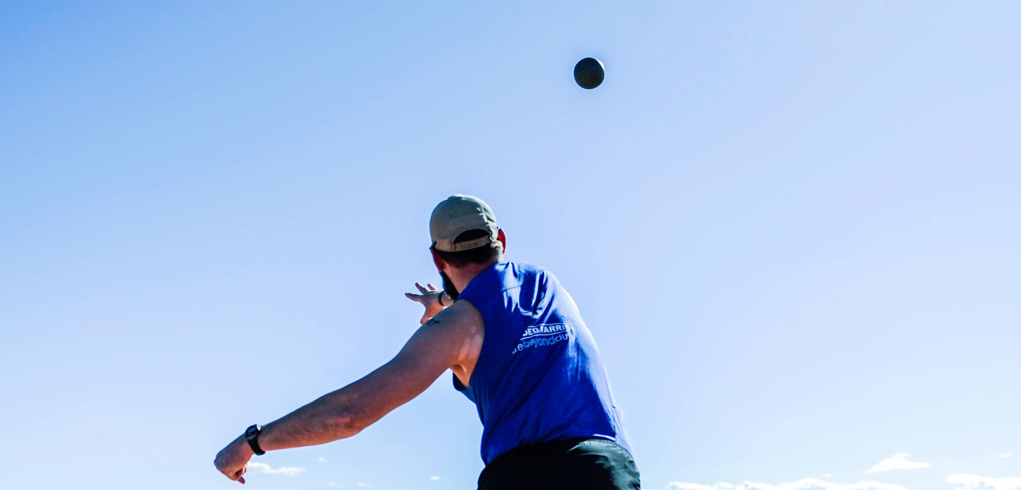 An Air Force Wounded Warrior Trials athlete throws a shot-put during the field competition of the AFW2 at Nellis Air Force Base, Nev., Feb. 28, 2017. Athletes from the United States, the United Kingdom and Australia came to compete for a spot in the 2017 Air Force wounded Warrior team. (U.S. Air Force photo by Airman 1st Class Kevin Tanenbaum/Released)