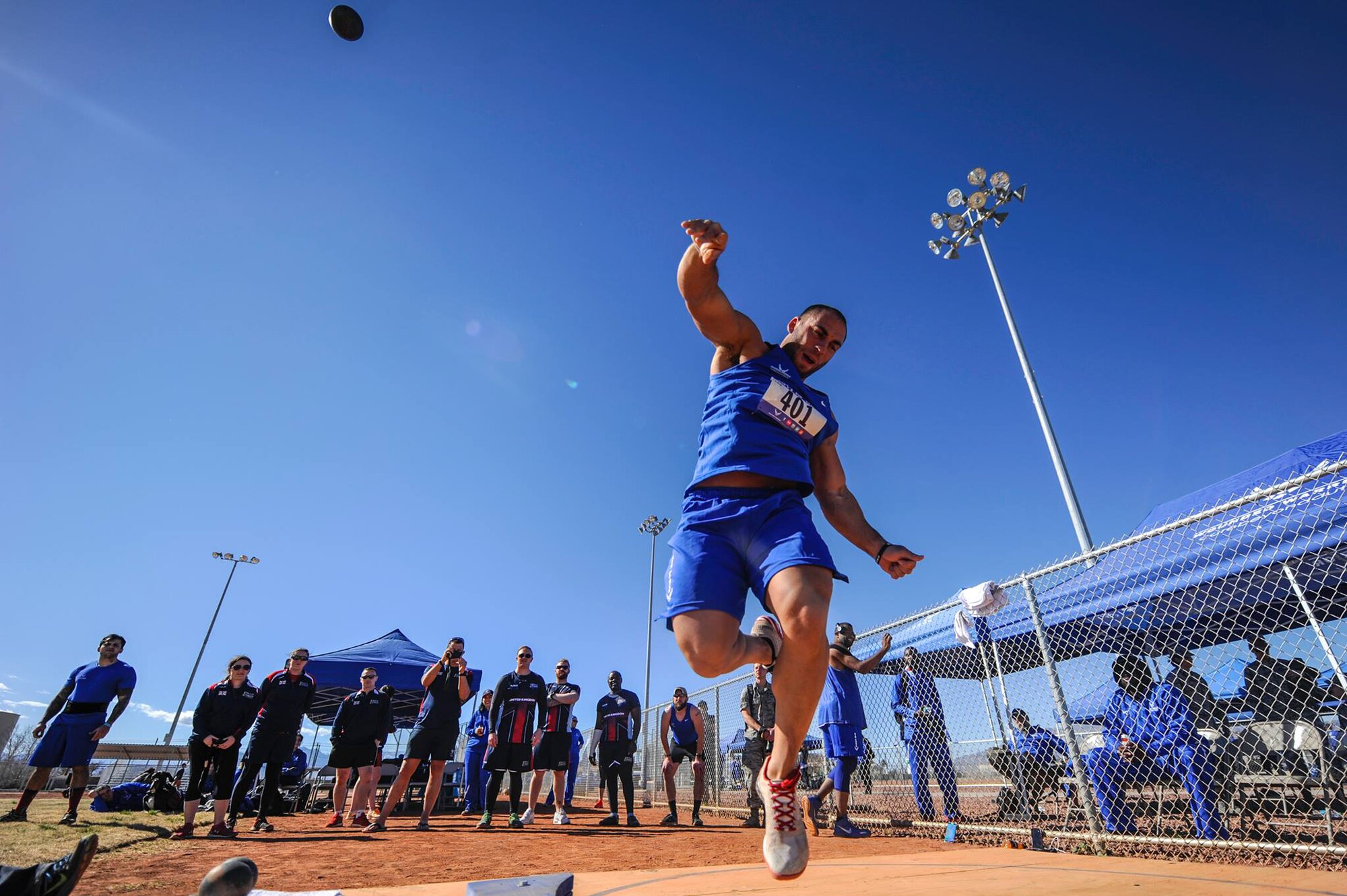 An Air Force Wounded Warrior Trials competitor throws a shotput during the field competition of the AFW2 at Nellis Air Force Base, Nev., Feb. 28, 2017. AFW2 focuses on specific personal and family needs and includes programs to address a gamut of situations throughout the recovery process. (U.S. Air Force photo by Airman 1st Class Kevin Tanenbaum/Released)