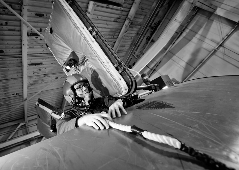 A 23rd Bomb Squadron aircrew member exits an egress simulator through a hatch during training at Minot Air Force Base, N.D., Feb. 22, 2017. The aircrew trained in a simulated aircraft, where they learned how and when to safely exit the aircraft to be prepared in the event of an emergency. (U.S. Air Force photo/Senior Airman J.T. Armstrong)