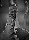 An aircrew member’s hands grasp a harness during emergency parachute training at Minot Air Force Base, N.D., Feb. 22, 2017. The training consists of a classroom lesson and hands-on practical lessons, which are an annual requirement for all aircrew. (U.S. Air Force photo/Senior Airman J.T. Armstrong)