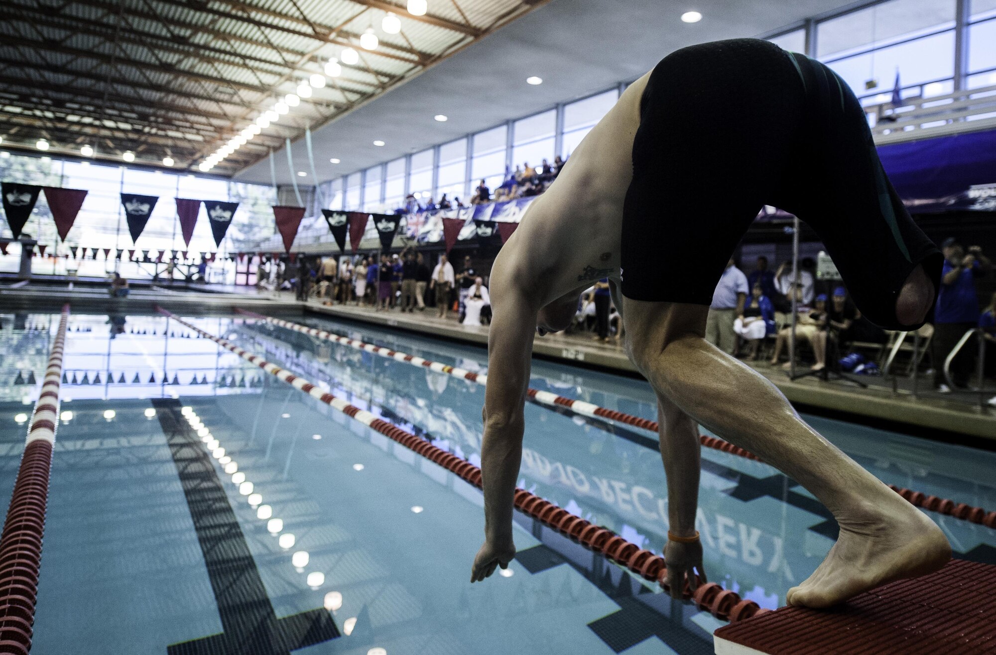 An Air Force Wounded Warrior Trials competitor dives in the pool during the men’s 50 meter freestyle during the Air Force Trials at the University of Nevada Las Vegas pool, Feb. 26, 2017. During the trials, wounded warriors competed in swimming, basketball, volleyball, track and field events, cycling, archery and shooting competitions. (U.S. Air Force photo by Airman 1st Class Kevin Tanenbaum/Released)