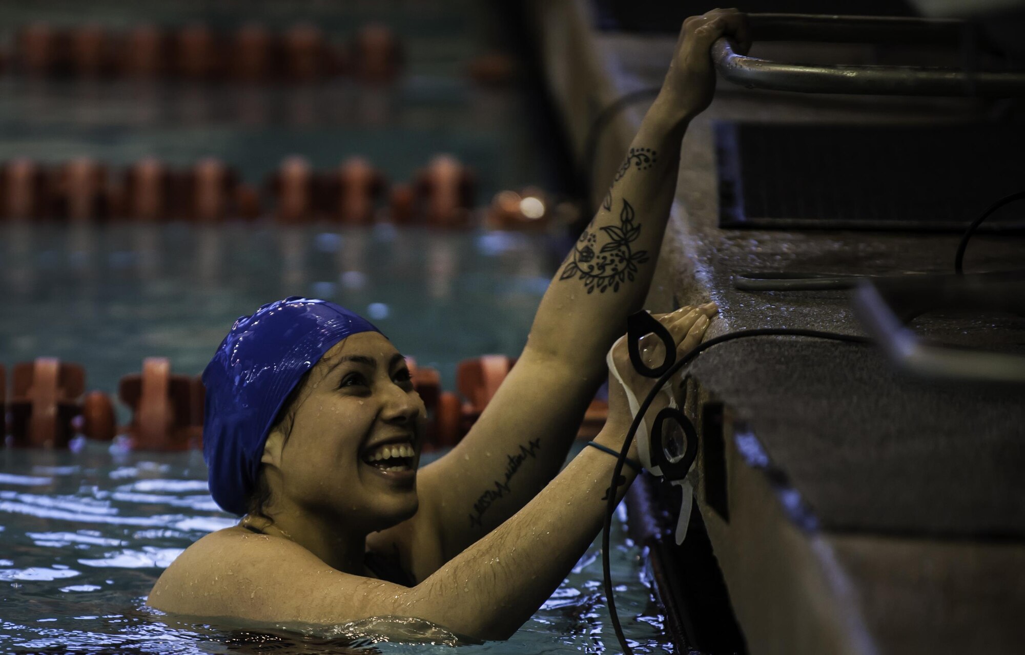 Maria Garcia, Air Force Wounded Warrior Trials competitor, smiles after finishing her competition during the AFW2 at the University of Nevada Las Vegas pool, Feb. 26, 2017. Maria is one of the United States Army competitors that Nellis AFB is playing host to. (U.S. Air Force photo by Airman 1st Class Kevin Tanenbaum/Released)