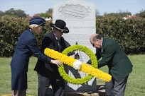 (Left to right) U.S. Air Force Brig. Gen. Heather Pringle, 502nd Air Base Wing and Joint Base San Antonio commander, retired Army Col. Stewart Wyland and retired U.S. Air Force Col. James Humphries lay a wreath at a memorial honoring Army Lt. Benjamin Foulois’ first military flight March 2, 2017. In 1910, Foulois became the first person to make a military flight, from a military facility, in a government owned plane flown by a military-trained pilot.(U.S. Air Force photo by Senior Airman Stormy Archer)