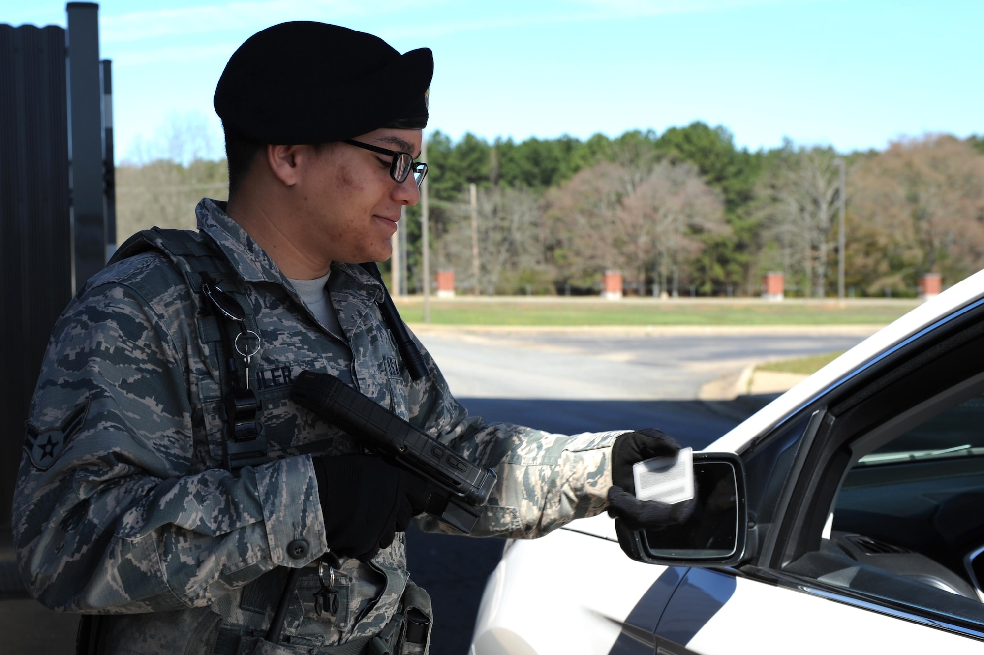 U.S. Air Force Airman 1st Class Kevin Soler, 19th Security Forces Squadron installation entry controller, uses the new Defense Biometric Identification System scanning equipment to verify the identity of an individual requesting entrance to base. The system is used to enable access control for military bases to enhance the force protection mission of defending the installation. (U.S. Air Force photo by Airman 1st Class Grace Nichols)